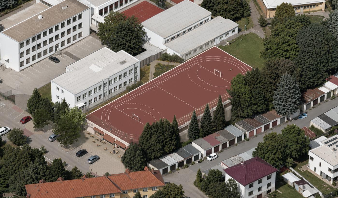Letecký pohled na areál školy s běžeckým oválem, kde hala vyroste